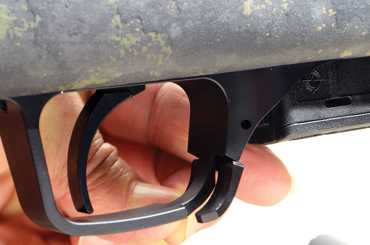 The magazine-release catch at the front of the trigger guard is ambidextrous and very convenient. The rifle will accept any AICS magazine intended for the Remington 700.